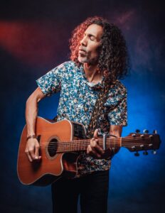 Guitar player learning new solos through free digital guitar resources