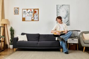 man trying to stay motivated to play guitar